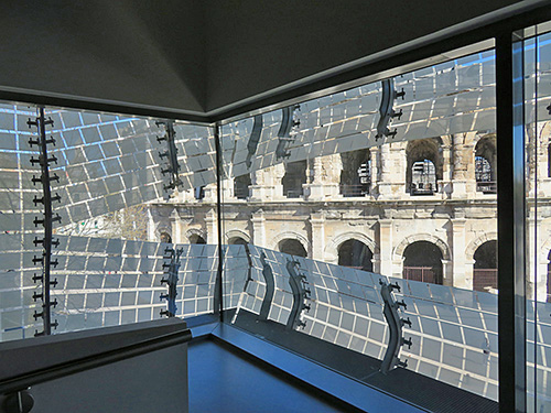 Fig. 2. View of the Roman amphitheater, as seen from inside the Musée de la Romanité, Nîmes.