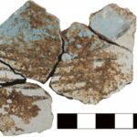 Fig. 4. Joining fragments (3055–15a, 3055–16f) of painted wall fresco, with blue, white, and black decoration, from area D-South.