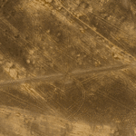 Fig. 5. Aerial archaeology in Jordan. Khirbet Abu Safat. The supposed Roman temporary camp has now been confirmed by a ground visit by Christopher Tuttle. The new photograph shows the characteristic Roman titulum (arrowed) barring direct approach to the gate opening.