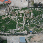 Fig. 5. Khirbet es-Suq, 8 km south of central Amman, showing the standing Ionic columns of a suspected Roman temple in an area of well-preserved monumental Roman mausolea.