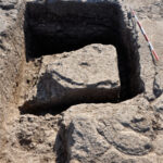 Fig. 4. Gabii, Area A, view of an assay pit dug in the bedrock south of the large quarry, from the west. Note the almost completely carved block, which was left on the bottom of the pit after being damaged.