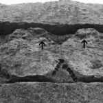 Fig. 1. Detail of the entablature of the Lion Gate relief, showing the location of tubular drill holes and saw marks. The arrows indicate the erroneous saw cut and the unknown filling material within it.