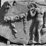 Fig. 5. Spandrel block from the Arch of Augustus with a genius and garland depicted in relief (G.R. Swain, archive photograph, 1924, no. 7.1371, Pisidian Antioch excavation archive, Kelsey Museum of Archaeology, University of Michigan; courtesy Kelsey Museum of Archaeology).