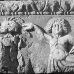 Fig. 9. Frieze block from the Arch of Hadrian and Sabina with relief depicting Tritons flanking a trophy (G.R. Swain, archive photograph, 1924, no. 5.0232, Pisidian Antioch excavation archive, Kelsey Museum of Archaeology, University of Michigan; courtesy Kelsey Museum of Archaeology).