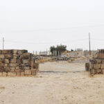 Fig. 3. The preserved remains of the Gate of Commodus as viewed from the east looking toward modern Umm el-Jimal. The West Church is visible on the left.