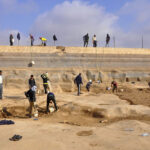 Fig. 4. Removing sediment from the floor of Umm el-Jimal’s Roman reservoir.