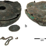 Fig. 3. Parts of a bronze inkwell from Tel Kedesh: a, bowl with small cover removed; b, bowl with small cover in place; c, fragments of a chain that probably once stretched across the top of the lid (P. Lanyi; courtesy Sharon Herbert and An­drea Berlin, Tel Kedesh Excavations)