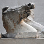 Fig. 12. Helios’ outer trace horse (east pediment B), with waves chiseled flat on plinth. London, British Museum.