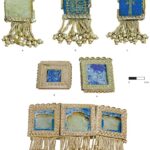 Fig. 9. Segments from forehead ornaments of gold, lapis lazuli, carnelian, and turquoise, probably from diadems with dorsal streamers. Segments b and c, respectively, depict a stylized and naturalistic palm tree. Ht. of longest segment (segment b) ca. 8 cm. Tomb II, Northwest Palace, Nimrud: a, ND 1989.32c; Baghdad, Iraq Museum, inv. no. 104815; b, ND 1989.32b; Iraq Museum, inv. no. 105814; c, ND 1989.32a; Iraq Museum, inv. no. 105813; d, ND 1989.41a; Iraq Museum, inv. no. 105828; e, ND 1989.41b; Iraq Museum, inv. no 105829; f, ND 1989.41c–e; Iraq Museum, inv. nos. 105830–32 (Hussein 2016, pl. 38; courtesy the Oriental Institute of the University of Chicago). Note that the inventory number (104815) for segment a may be printed incorrectly in Hussein 2016, 79. Because all the other segments in this assemblage have inventory numbers beginning with “105,” the correct inventory for segment a may be 105815.