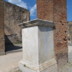 Fig. 6. Arch for the Holconii, northwestern pier with an oblique view of the statue pedestal dedicated to Marcus Holconius Rufus, Pompeii, Italy, first century C.E.