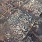 Fig. 8. Aerial view of the Cyclopean Platform from the east. The white arrow points to blocks displaced by bulldozer.