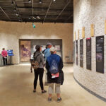 Fig. 2. “Foundations of Petra” gallery with visitors and museum staff member.