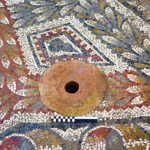 Fig. 7. Detail of the terracotta drain near the center of the mosaic floor in the frigidarium (Room 1) (scale: 20 cm).