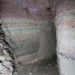 Fig. 18. View northward from Grotto 5 past the blockage of Grotto 4. Masonry is almost entirely lacking in this section of the zigzag channel (R.B. Gorham).