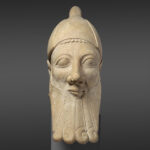 Fig. 1. Limestone head of a bearded man, Cypriot, early sixth century BCE, ht. 191.8 cm. New York, Metropolitan Museum of Art 74.51.2857, acq. between 1874 and 1876 as part of the Cesnola Collection, purchased by subscription (courtesy Metropolitan Museum of Art).