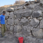 Fig. 4. The thick stone wall BB2008 on the eastern slope, with a preserved length of 11 m. Most of this building had eroded away. Floors relating to it from inside the city point to an LBA date.