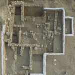 Fig. 6. Aerial view of the Level VI North-East Temple in Area BB. White sandbags secure the balks (E. Aladjem, Israel Antiquities Authority).